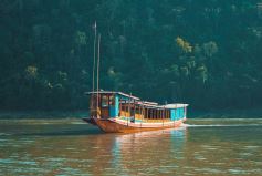 Slow boat to Pak Ou caves and Kuang Si falls Full-day tour